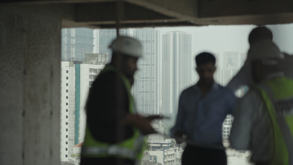 A professional construction site showcasing project management and urban development activities, highlighting modern infrastructure, skilled teamwork, and premium real estate construction standards.