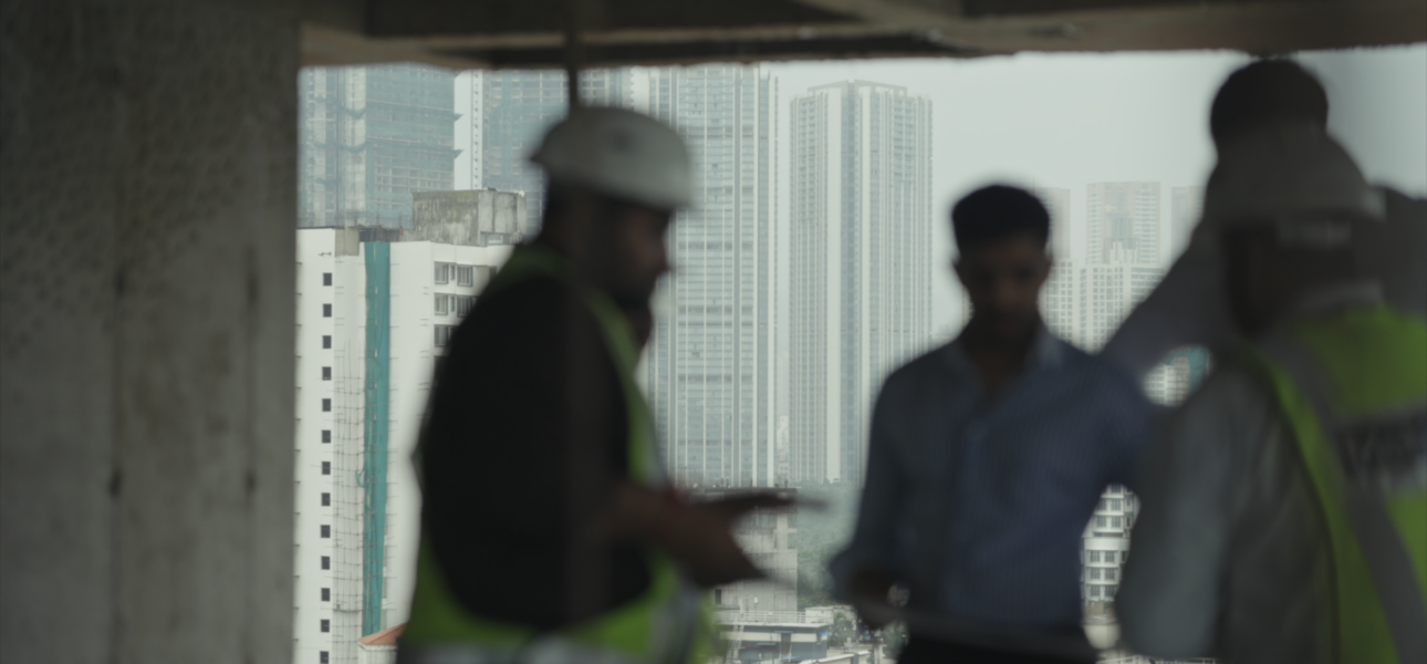 A professional construction site showcasing project management and urban development activities, highlighting modern infrastructure, skilled teamwork, and premium real estate construction standards.
