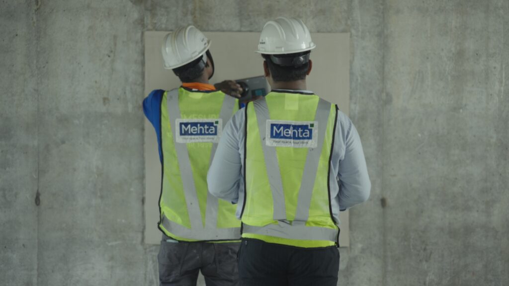 A skilled construction team conducting on-site inspection and project execution activities, ensuring quality construction standards, modern engineering practices, and efficient real estate development.
