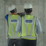 A skilled construction team conducting on-site inspection and project execution activities, ensuring quality construction standards, modern engineering practices, and efficient real estate development.